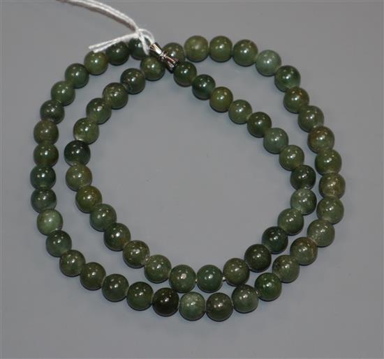 A Chinese green stone bead necklace